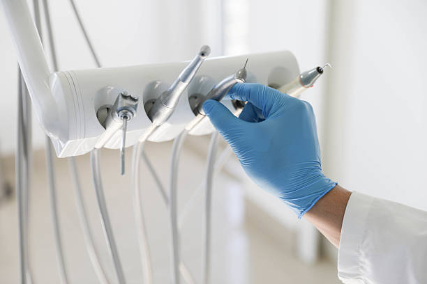 Professional Tooth Extraction technician working in Kansas City, MO